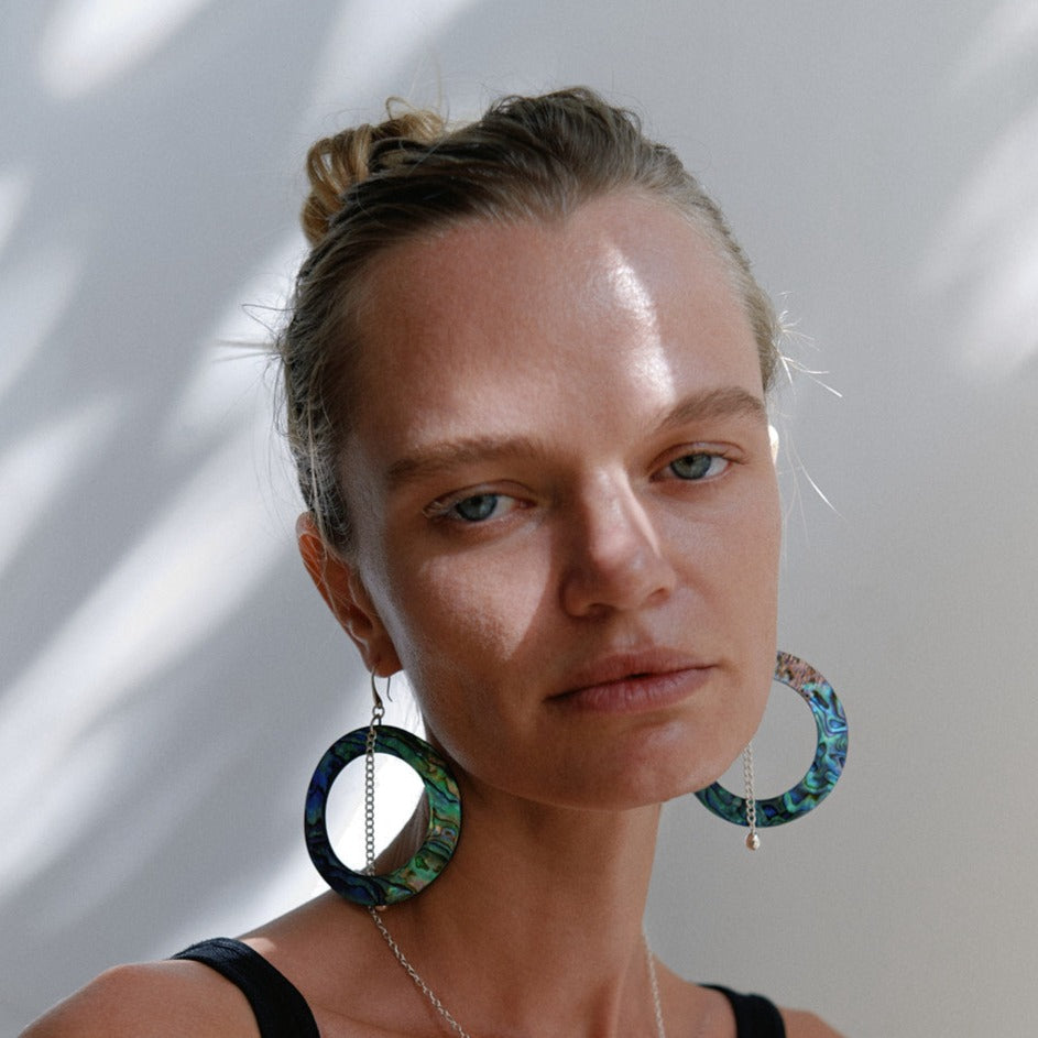 SELF LOVE COLLECTION SHELL CHAIN EARRINGS earrings made from real shells the circle is Ø6CM 6CM dangling chain at the end a Ø0.5CM ball A hook for the ear hole 925 recycled sterling silver Handmade in Bali